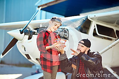 Young dad explains his kid aeronautical basics and principles Stock Photo