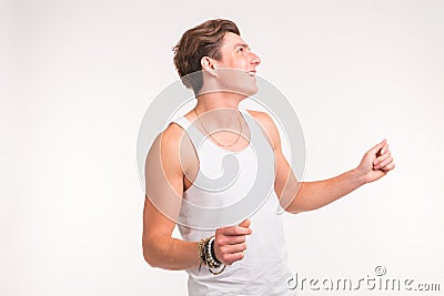 Young handsome dancing man on a white background Stock Photo