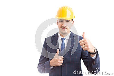 Young handsome engineer making thumbs up gesture Stock Photo