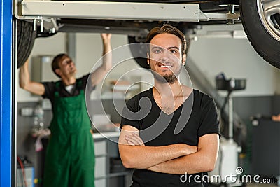 A young handsome guy in a black T-shirt is photographed against Stock Photo