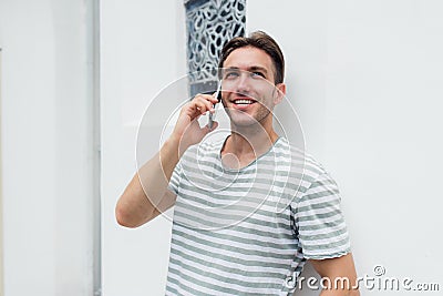 Young handsome man talking on the phone Stock Photo