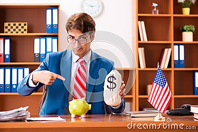 The young handsome politician sitting in office Stock Photo