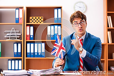 The young handsome politician sitting in office Stock Photo