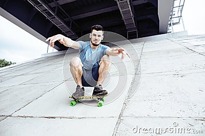 young handsome real hipsrter guy bearded staying under the bridg Stock Photo