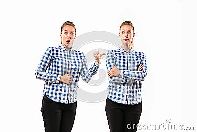 Young handsome woman arguing with herself on white studio background. Stock Photo