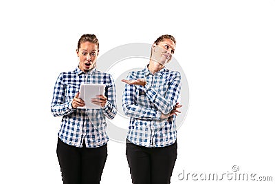 Young handsome woman arguing with herself on white studio background. Stock Photo