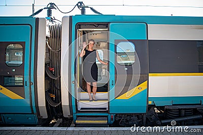 young handsome woman on a train leaves for a business trip to see a business partner Stock Photo