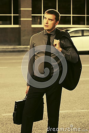 Young hansome business man walking in city street Stock Photo