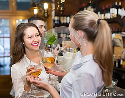 Young happy adults at bar Stock Photo