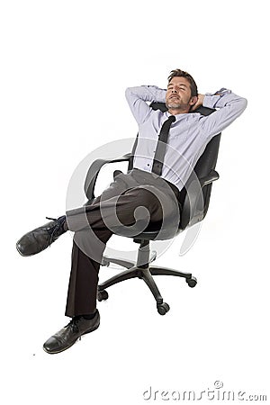 Young happy attractive businessman leaning relaxed sitting on office chair isolated on white Stock Photo