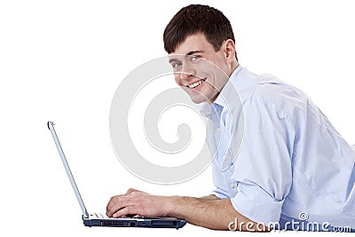 Young, happy, attractive man with computer Stock Photo