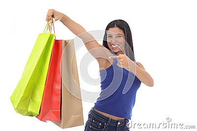 Young happy and beautiful hispanic woman holding color shopping bags smiling excited isolated Stock Photo