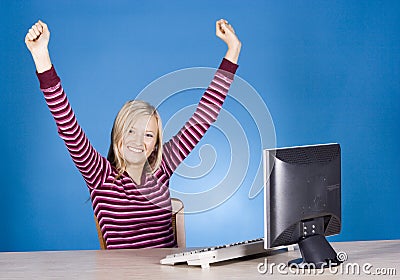 Young happy blonde woman at the computer Stock Photo