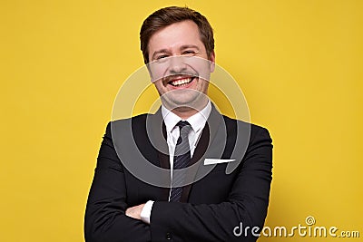 Young happy businessman with mustache smiling being self proud with his success Stock Photo