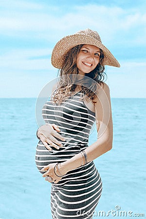 Young happy cheerful pregnant woman smilling and enjoing life in Stock Photo