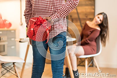 Young happy couple celebrating Valentine`s day with a gift Stock Photo