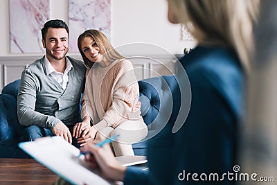 Young happy couple after therapy session with family psychologist Stock Photo
