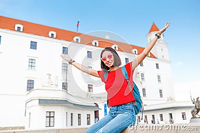 Happy female tourist in Bratislava city near Castle or Hrad. Travel in Slovakia and Europe Union concept Stock Photo