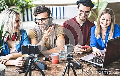 Young happy friends sharing content on streaming platform with digital web camera - Modern marketing concept with millenials Stock Photo