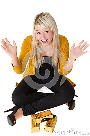 Young happy girl with goldbars Stock Photo