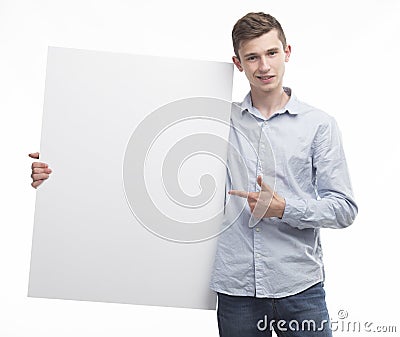 Young happy man showing presentation, pointing on placard Stock Photo