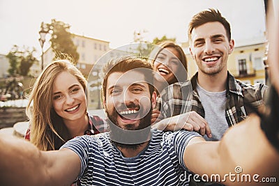 Young Happy People Have Fun Outdoors in Autumn. Stock Photo