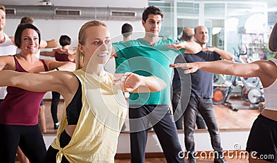 Young happy people studying zumba elements Stock Photo