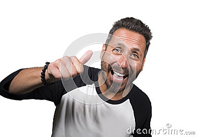 Young happy and positive attractive 40s man with blue eyes and beard smiling happy and cheerful wearing casual sporty tshirt Stock Photo