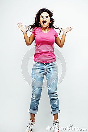 Young happy smiling latin american teenage girl emotional posing on white background, jumping flying in joy, lifestyle Stock Photo