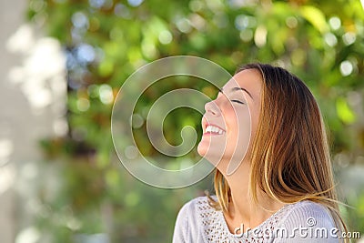 Young happy smiling woman doing deep breath exercises Stock Photo