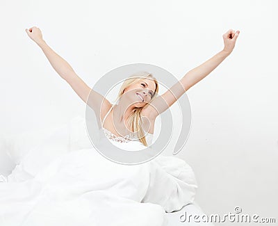 Young happy smiling woman waking up Stock Photo