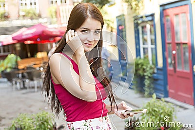 Young happy teenage girl in urban place Stock Photo