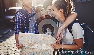 Young happy tourists sightseeing in city Stock Photo