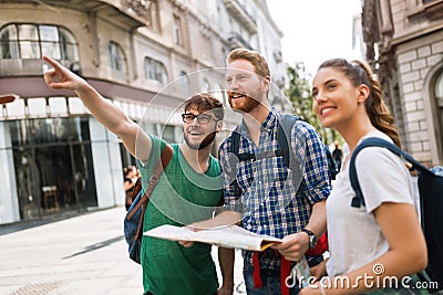 Young happy tourists sightseeing in city Stock Photo