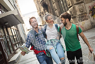 Young happy tourists sightseeing in city Stock Photo