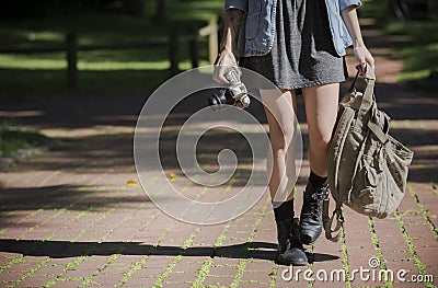 Young happy traveler exploring surrounds with film camera Stock Photo