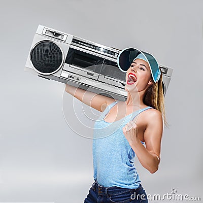 Young happy woman with boombox Stock Photo