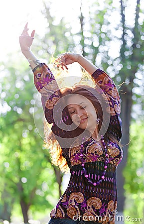 Young happy woman enjoys sun Stock Photo