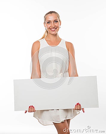 Young happy woman showing presentation, pointing on placard. Stock Photo