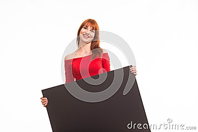 Young happy woman showing presentation, pointing on placard Stock Photo