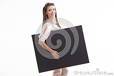 Young happy woman showing presentation, pointing on placard Stock Photo