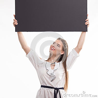 Young happy woman showing presentation, pointing on placard Stock Photo