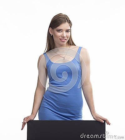 Young happy woman showing presentation, pointing on placard Stock Photo