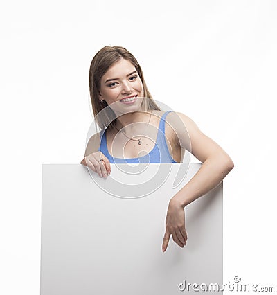 Young happy woman showing presentation, pointing on placard Stock Photo