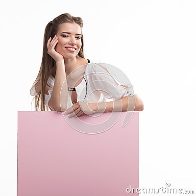 Young happy woman showing presentation, pointing on placard Stock Photo