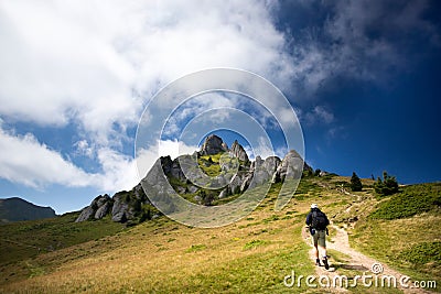 Young hiker backpacker in romanian Ciucas mountains Stock Photo