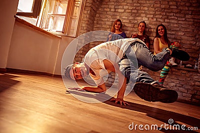 Young hip hop men performs break dancing moves Stock Photo