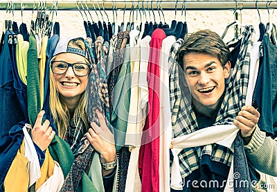 Young hipster couple in love at the weekly cloth market Stock Photo