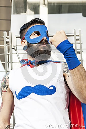 Young hipster superhero fights evil Stock Photo