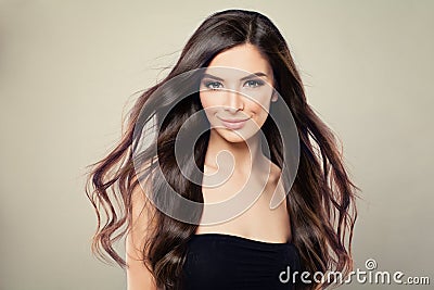 Young Hispanic Fashion Model Woman with Brown Blowing Hair Stock Photo